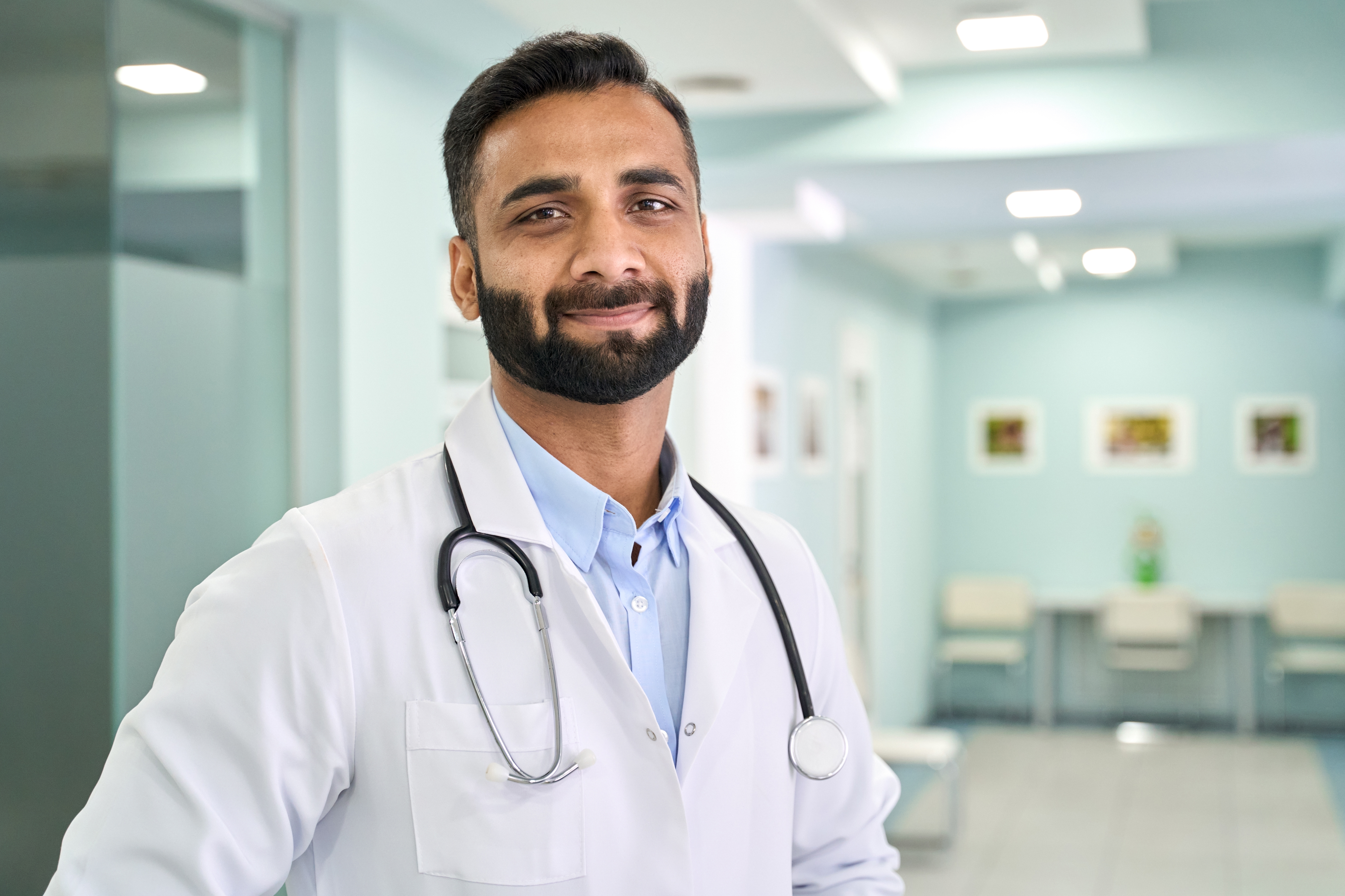 smiling doctor in white coat